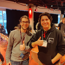 Networking at GraphQuon 2024 — ÉTS hoodie and conference badges, thumbs up between talks