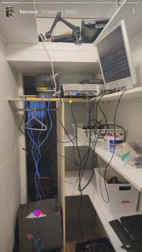 Homelab server closet — rack server, switch, monitor, and cabling