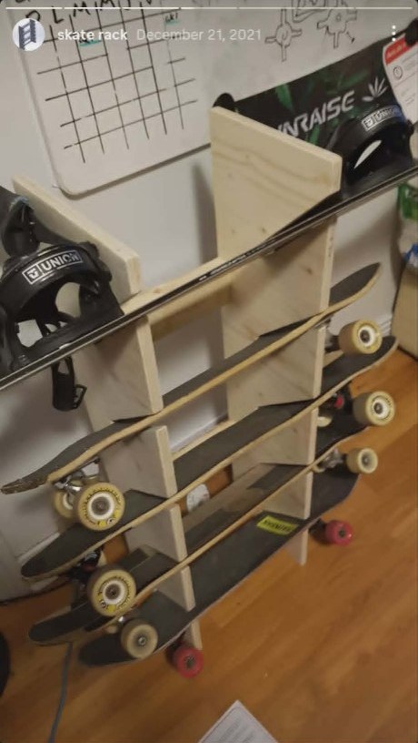 Finished wooden skate and snowboard rack with boards loaded