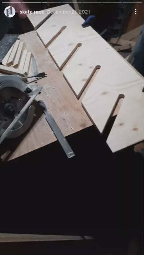Plywood side panel with diagonal slots cut on a workbench