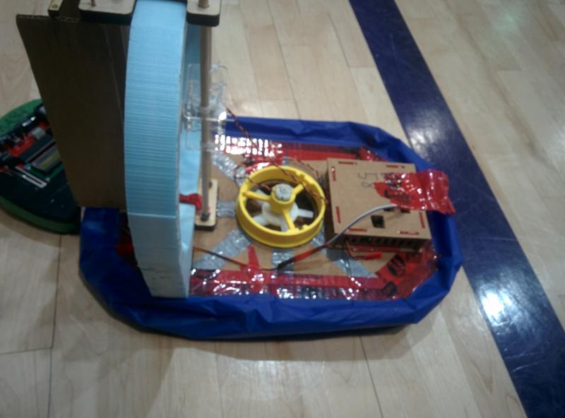 ÉTS hydroglisseur prototype — lift fan, wooden deck, and blue inflatable skirt on the workshop floor